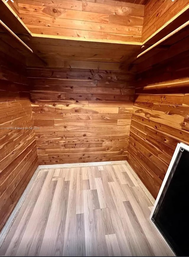 spacious closet with wood finished floors