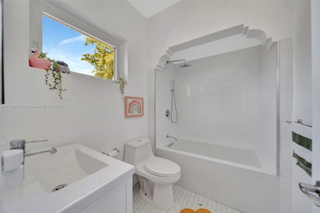 bathroom with vanity, toilet, and bathing tub / shower combination