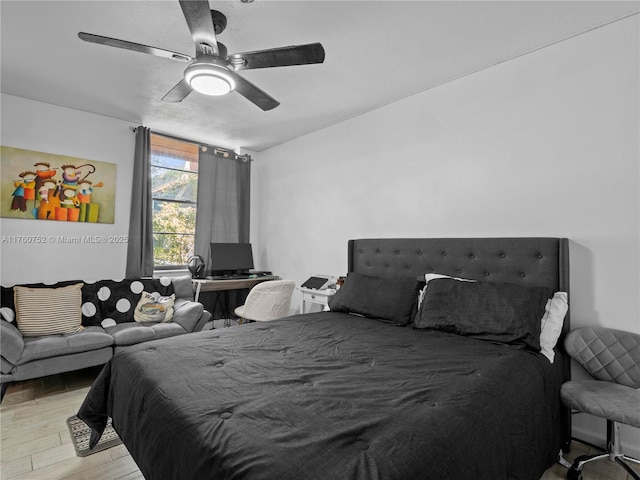 bedroom featuring light wood finished floors and ceiling fan