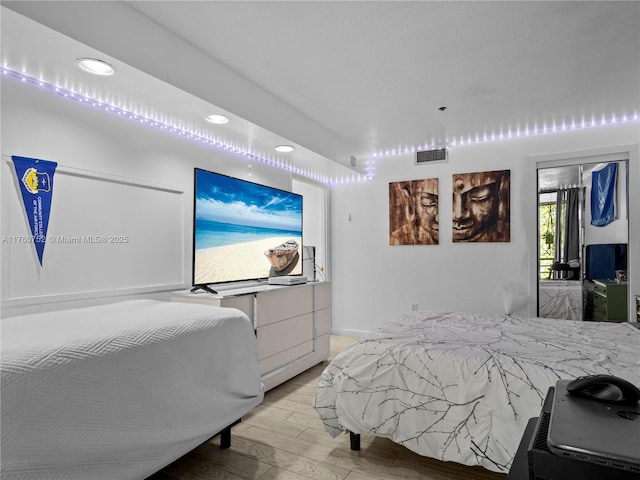 bedroom featuring recessed lighting, visible vents, and light wood-style floors