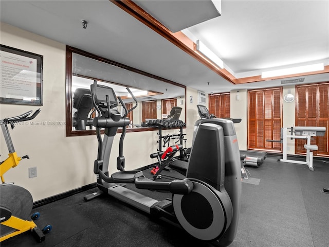 gym featuring visible vents and baseboards