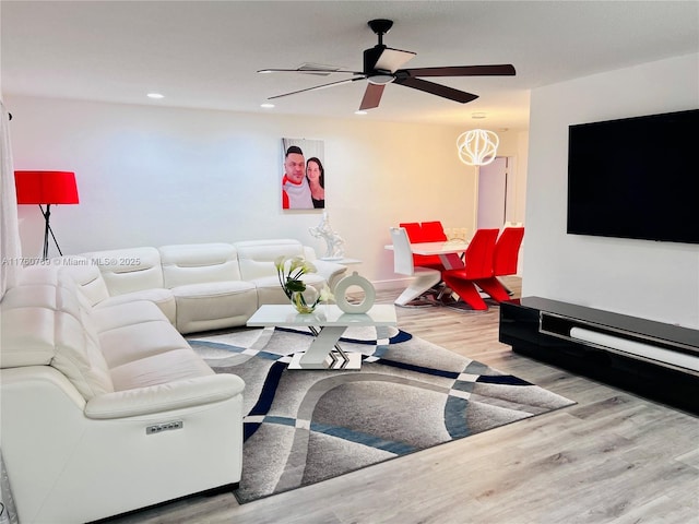 living room featuring recessed lighting, wood finished floors, and a ceiling fan