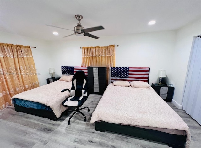 bedroom with a ceiling fan, recessed lighting, wood finished floors, and baseboards