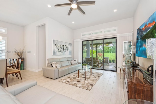 living room featuring recessed lighting, light wood-style floors, and a ceiling fan