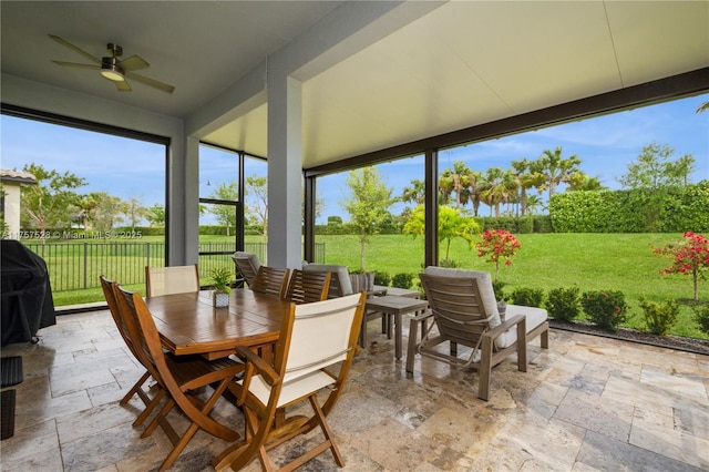 sunroom / solarium with ceiling fan