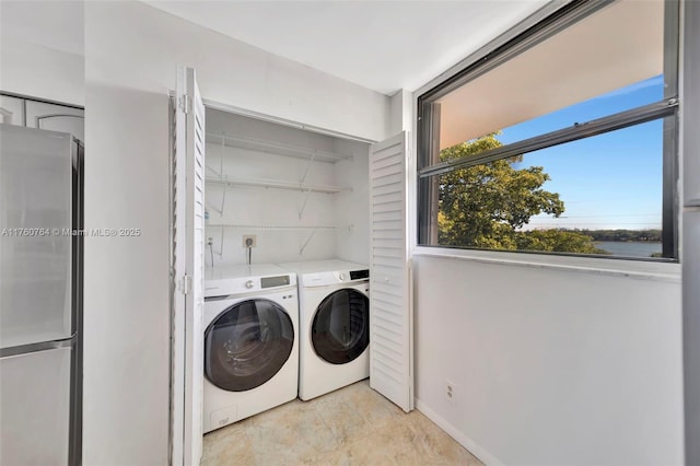 117 Lake Emerald Dr Unit 408, Oakland Park, FL 33309 - washroom featuring washing machine and clothes dryer