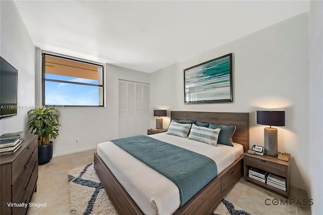 117 Lake Emerald Dr Unit 408, Oakland Park, FL 33309 - bedroom featuring a closet and baseboards