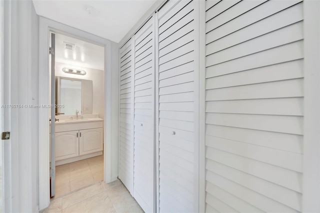 117 Lake Emerald Dr Unit 408, Oakland Park, FL 33309 - hallway featuring a sink and light tile patterned flooring