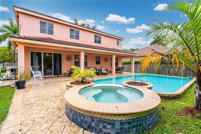 view of swimming pool featuring a fenced in pool, a patio, an in ground hot tub, and a fenced backyard