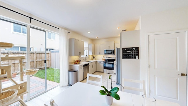 1040 SE 24th Ave, Homestead, FL 33035 - kitchen featuring visible vents, light countertops, recessed lighting, stainless steel appliances, and a sink