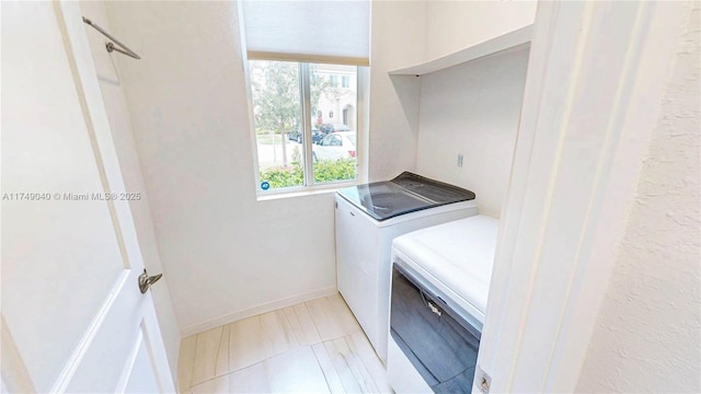 1040 SE 24th Ave, Homestead, FL 33035 - laundry area featuring laundry area, plenty of natural light, baseboards, and washer and clothes dryer