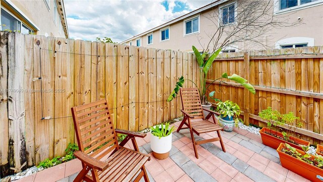 1040 SE 24th Ave, Homestead, FL 33035 - view of patio featuring fence