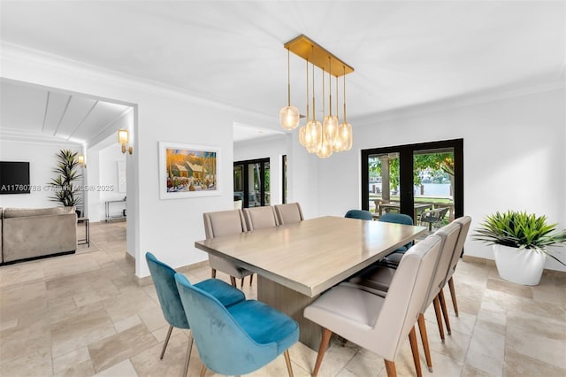 dining space featuring french doors, baseboards, and ornamental molding