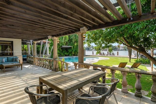 view of patio / terrace with outdoor lounge area, outdoor dining area, an outdoor pool, and a water view