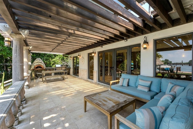 view of patio / terrace with an outdoor living space, french doors, a pergola, and outdoor dining area