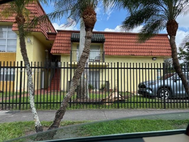 view of gate featuring a fenced front yard