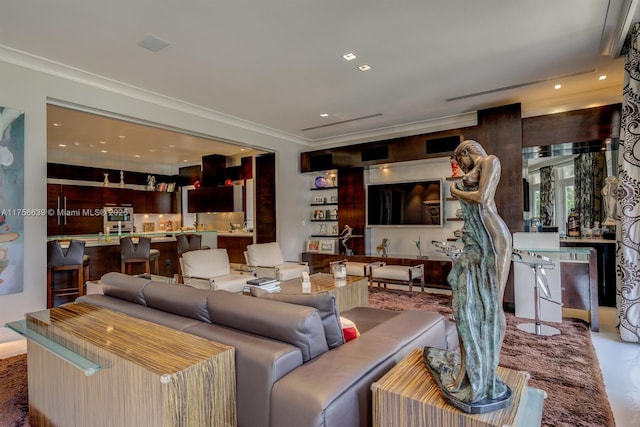 living room with recessed lighting and ornamental molding