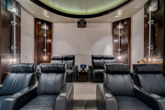 carpeted home theater room with visible vents