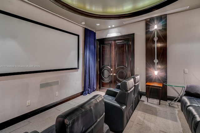 carpeted cinema room featuring baseboards