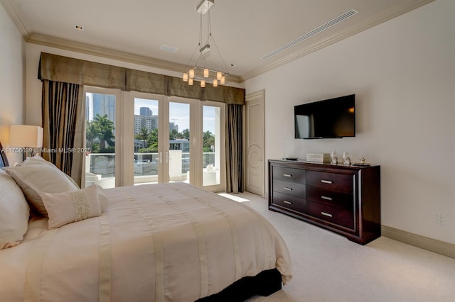 bedroom with access to outside, carpet flooring, baseboards, and ornamental molding