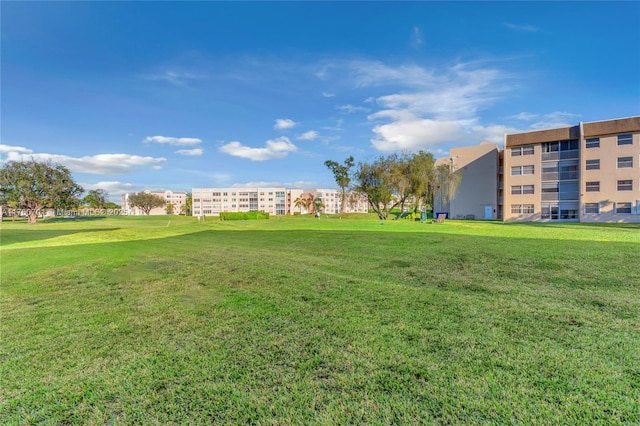 view of home's community featuring a lawn