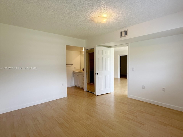 1504 S Whitehall Dr Unit 206, Davie, FL 33324 - empty room featuring light wood finished floors and a textured ceiling