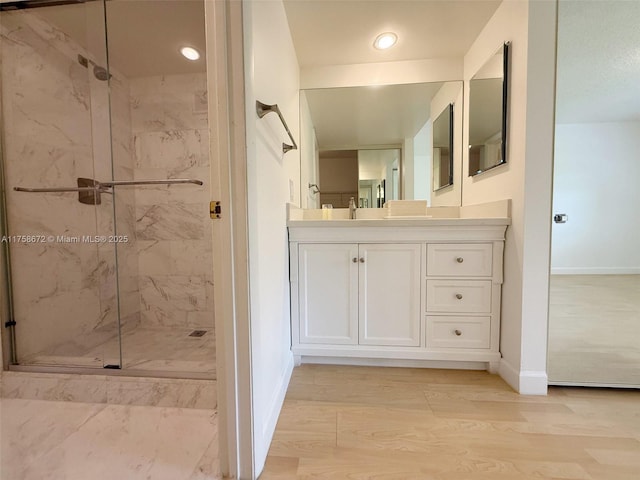 1504 S Whitehall Dr Unit 206, Davie, FL 33324 - full bathroom featuring a marble finish shower, vanity, wood finished floors, and recessed lighting