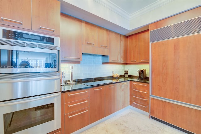 kitchen with decorative backsplash, built in fridge, stainless steel double oven, crown molding, and black electric cooktop