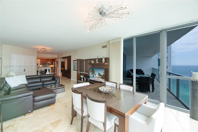 dining space featuring expansive windows and visible vents