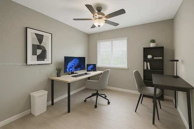 office with ceiling fan, baseboards, and light wood-type flooring