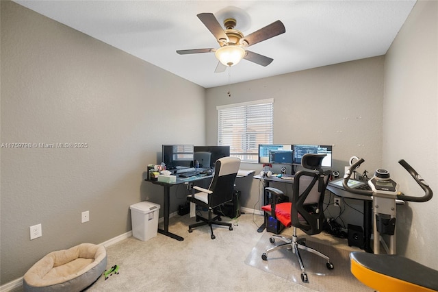 carpeted office with baseboards and ceiling fan