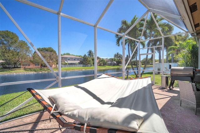 unfurnished sunroom with a water view