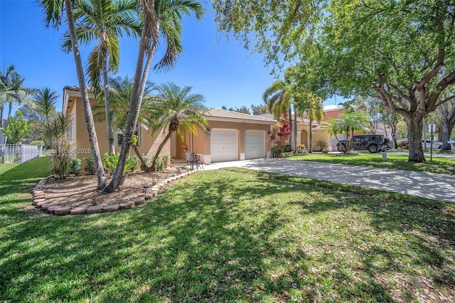 view of front of home with a front lawn, a garage, driveway, and stucco siding