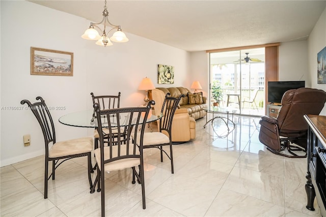 dining space with expansive windows, baseboards, marble finish floor, and ceiling fan