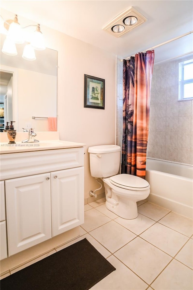 full bathroom featuring tile patterned floors, shower / bath combo with shower curtain, toilet, and vanity