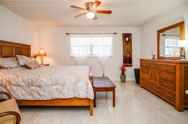 bedroom with multiple windows and ceiling fan