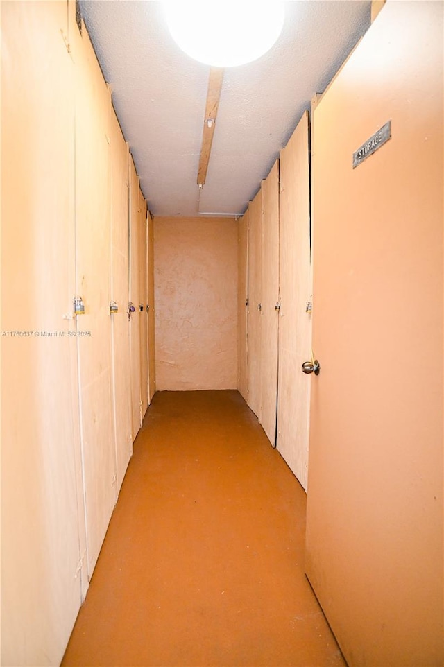 hallway featuring finished concrete flooring