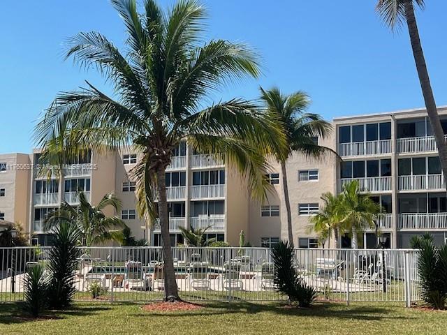 view of building exterior featuring fence