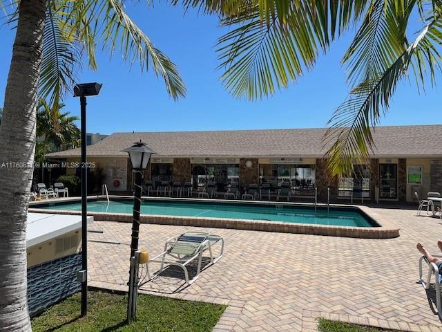 community pool with a patio