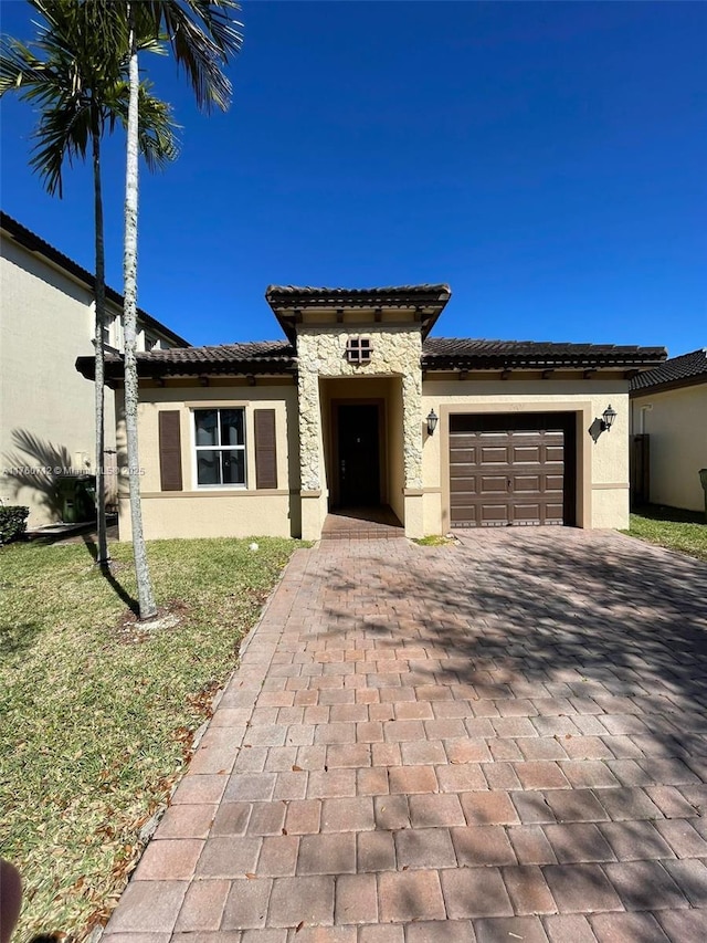 view of front of property with stone siding, stucco siding, decorative driveway, and a garage