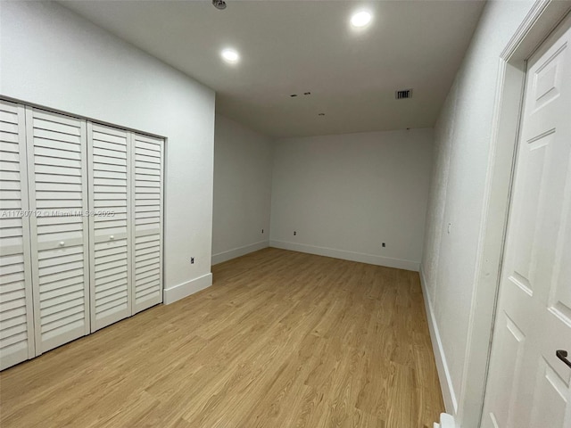 unfurnished bedroom with recessed lighting, baseboards, visible vents, and light wood finished floors