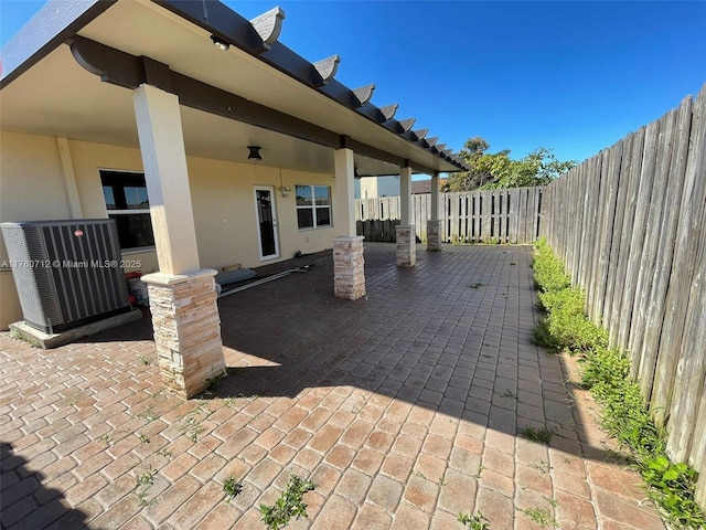 view of patio / terrace with a fenced backyard and central AC