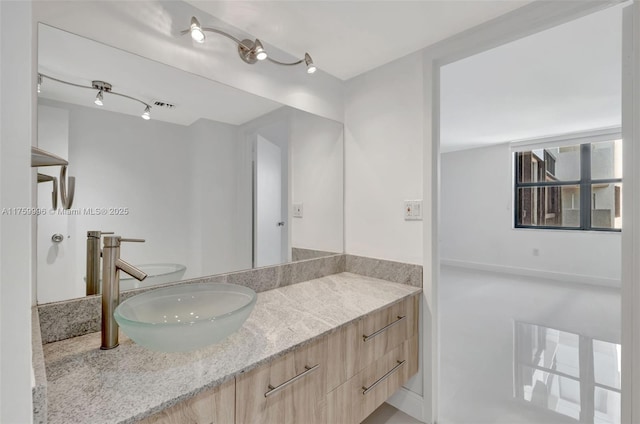 bathroom featuring vanity and visible vents