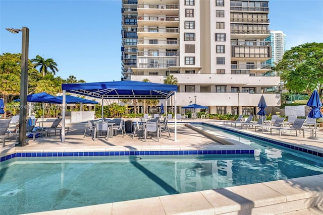 community pool with a patio area