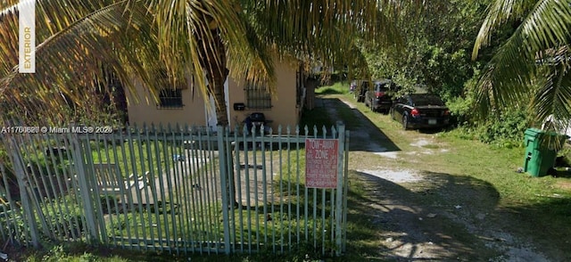 view of gate with fence