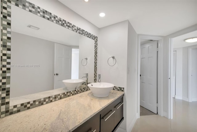 full bath featuring recessed lighting, visible vents, and vanity