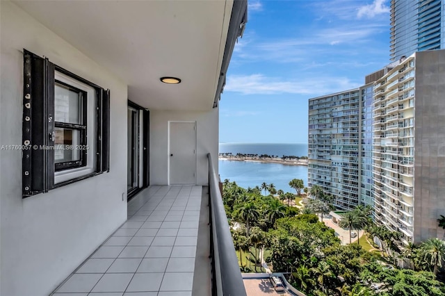 balcony featuring a water view