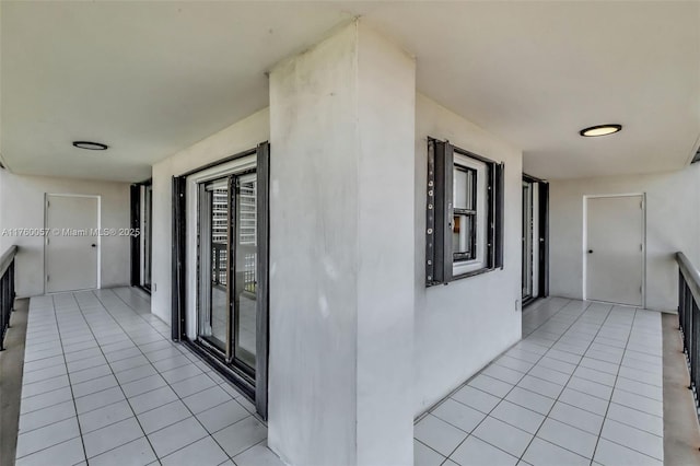 corridor with light tile patterned floors