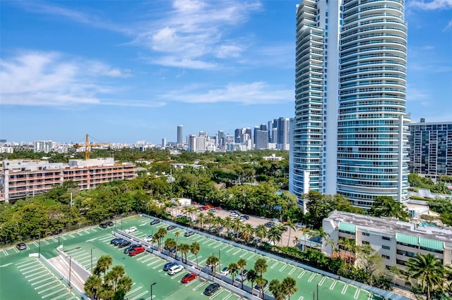 exterior space with a city view and a water view