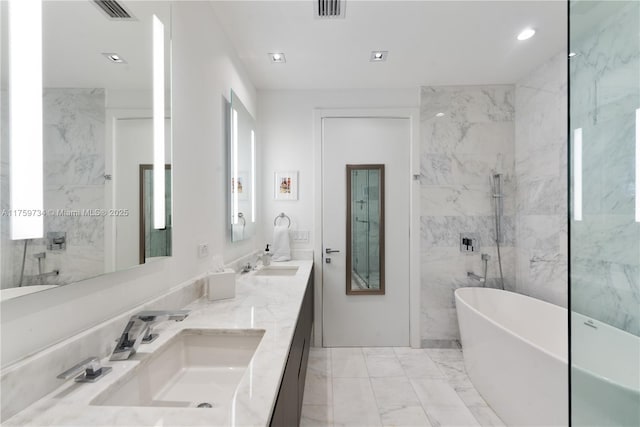 1451 Brickell Ave Unit 4002, Miami, FL 33131 - full bath featuring a freestanding bath, marble finish floors, double vanity, and recessed lighting